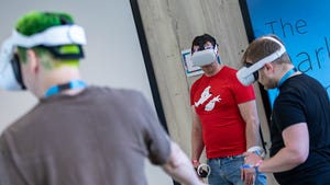 Three nDreams employees use VR headsets.